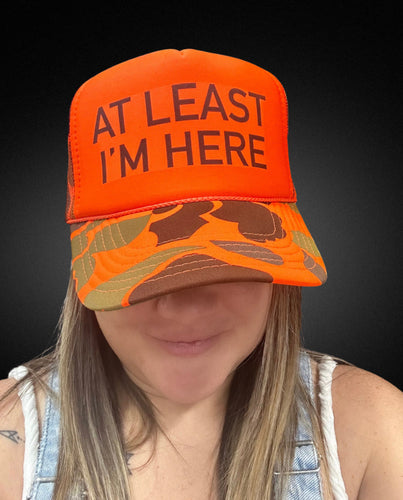 At Least I'm Here Trucker Hat