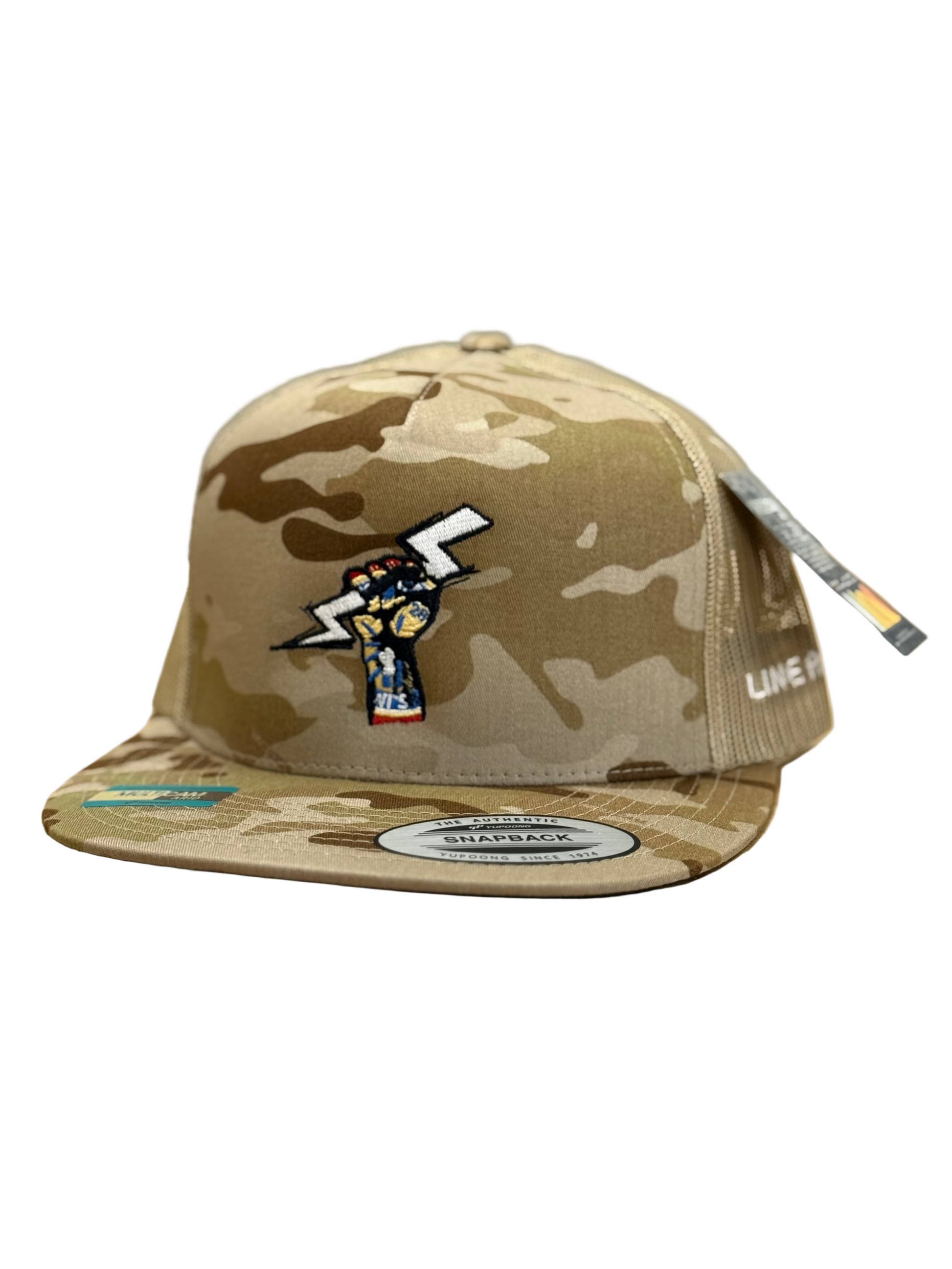 Camouflage cap with a logo on a beige surface